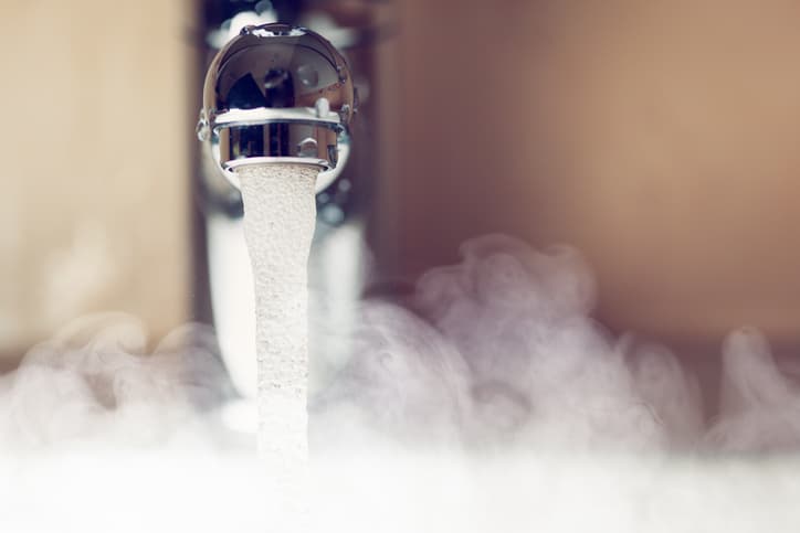 sink faucet with running hot water steaming