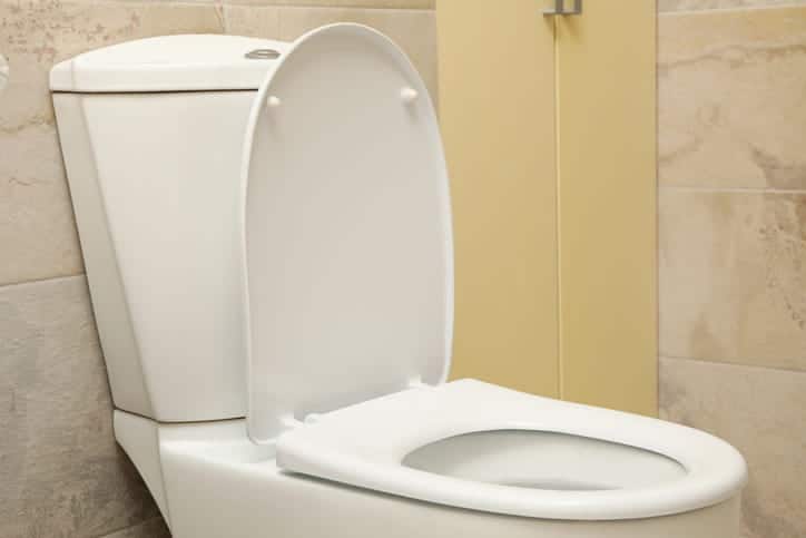 A new toilet installed in a bathroom. 