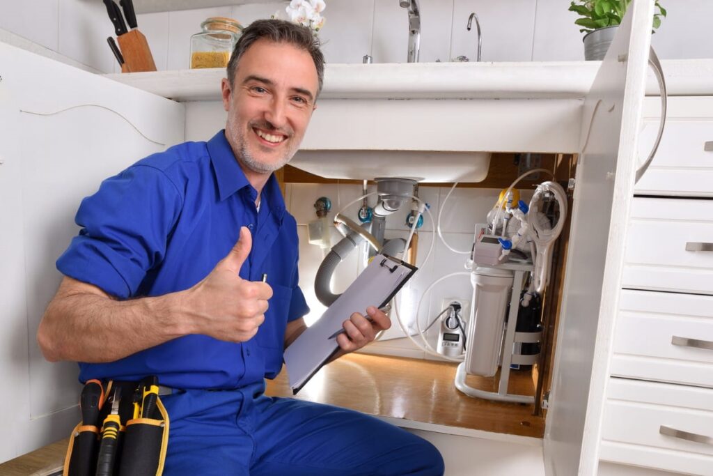 A Las Vegas plumber smiling and giving a thumbs up. 